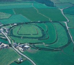 An aerial photograph showing the multiple ramparts of Clovelly Dykes hillfort as earthen banks and hedges.