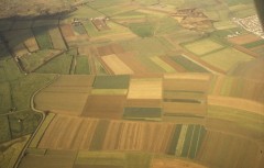 A colour aerial photograph showing the various strips of unenclosed fields in the surviving medieval open field system known as Braunton Great Field