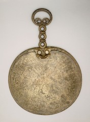 Iron Age bronze mirror from Holcombe, East Devon. Photo: © The Trustees of the British Museum.