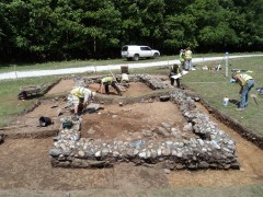 Colour photograph of the low remains of a stone-built rectangular structure; a tinner's hut being excavated at Hemerdon.