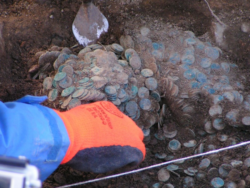 The coin hoard being excavated