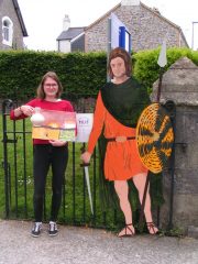 Exeter University Student Intern, Calypso, at the Ipplepen Hub with her new friend and artwork produced by local school children.