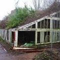 Bicton College. Ruinous glasshouses running against north wall of walled garden, prior to recording and demolition (looking WNW, 2 x 1m scales). Copyright COAS Ltd.