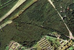 A colour aerial photograph of a wooded area.