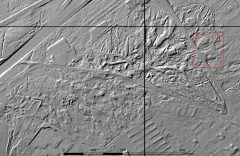 A black and white lidar visualisation of a complex of irregular earthwork mounds and ditches.