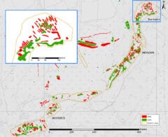 A greyscale map, overlain by transcriptions of earthwork banks, ditches, mounds and pits within an irregular area on both sides of the river.