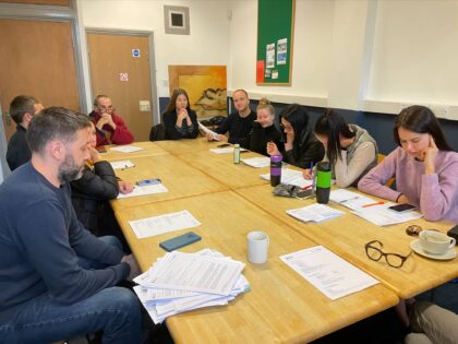 learners sat around a desk