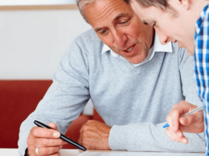 teacher and student reviewing work