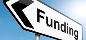 signpost with word funding on it