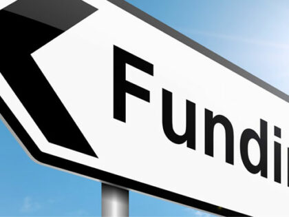 signpost with word funding on it