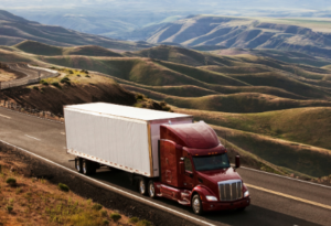 image of truck with mountains behind
