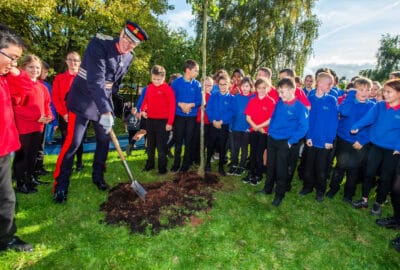 Lord Lieutenant with school children and a tree