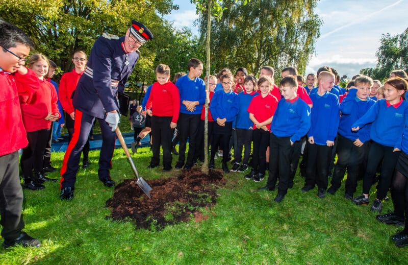 Lord Lieutenant with school children and a tree