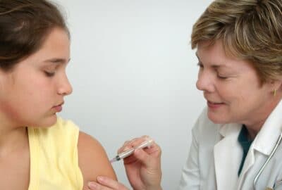 Young girl receiving her vaccination