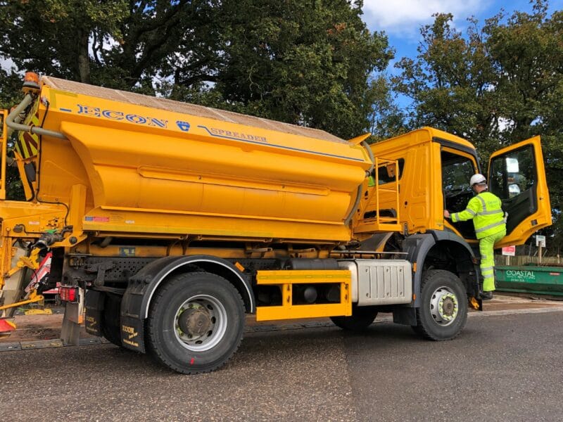 Gritter driver getting into a gritting lorry