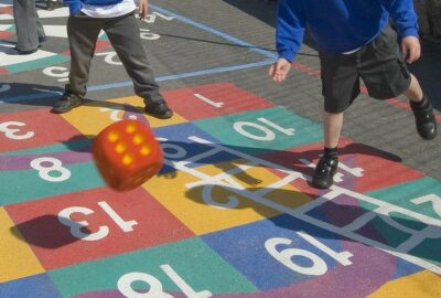 school children playing in a playground