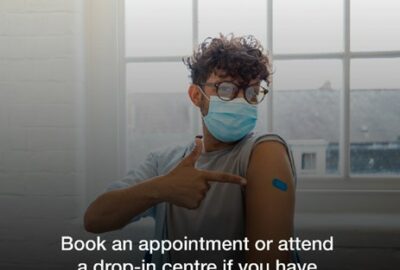 Vaccination advert - young man, wearing a face covering, having his vaccination