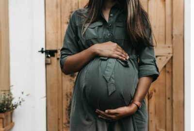 Pregnant lady, holding her tummy