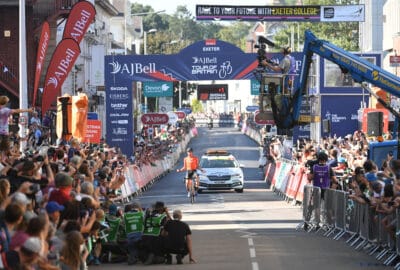 Photo of Rally Cycling's Robin Carpenter crossing the finish line in Exeter