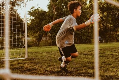 young boy playing football