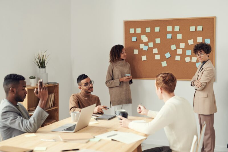 People at work in an office having a meeting