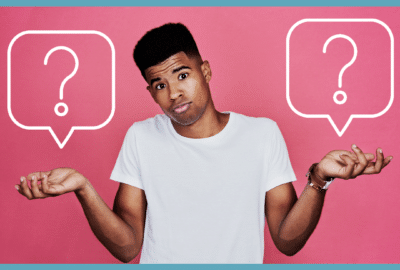 man holding question marks