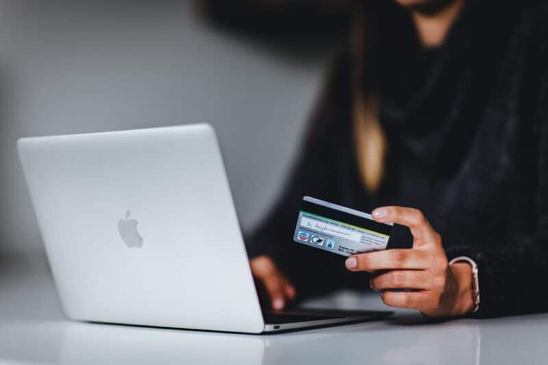 Women using a laptop with credit card in her hand