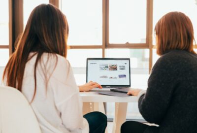 Two women working at a computer