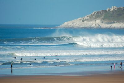 Surfers on the beach at Croyde Bay