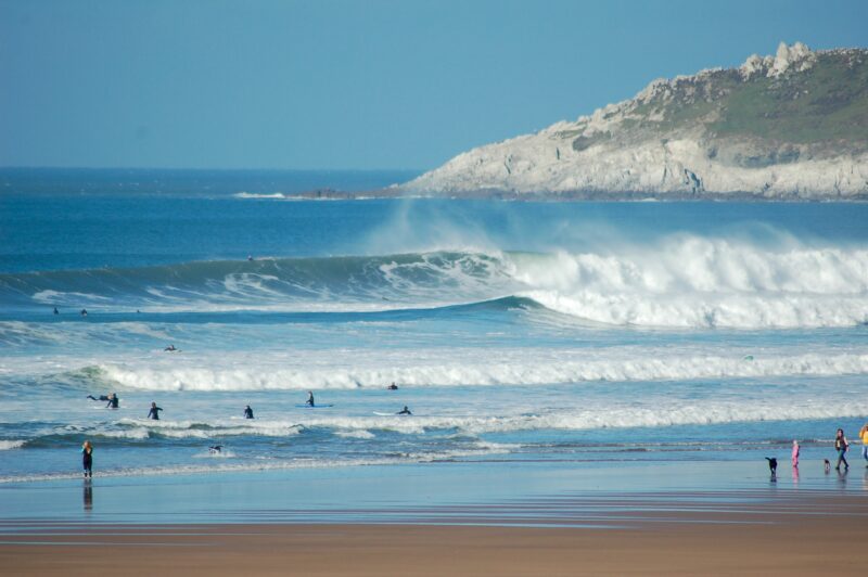 Surfers on the beach at Croyde Bay