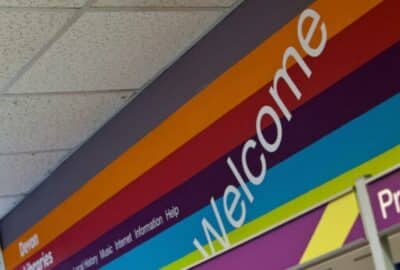 A 'welcome' sign above the door of one of our libraries