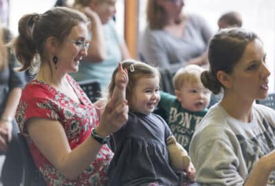mother and young child enjoying themselves at a library