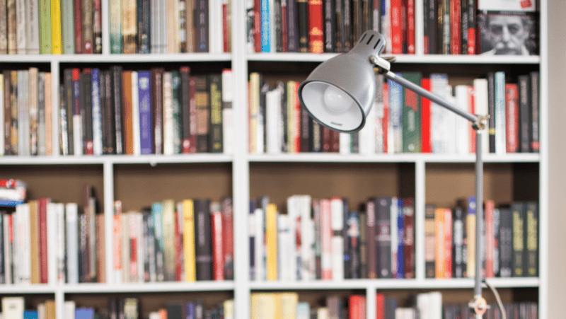 library books and a lamp