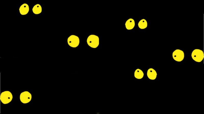 Yellow cartoon eyes in the dark