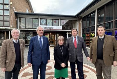 The Leader of Devon County Council, local Councillors and Cabinet Member, stood with the Head of Tiverton High School outside the school building