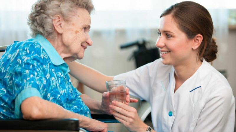 An elderly lady and care worker