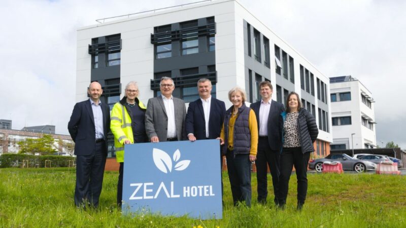 Stakeholders stood on land where hotel will be built