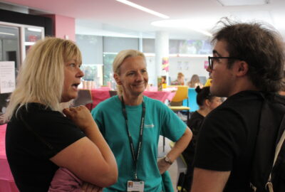 A young person chatting to the Council's Chief Executive, Donna Manson and Head of Economy and Skills, Keri Denton