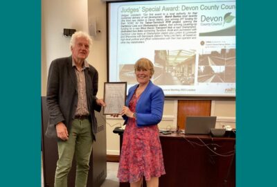 Christian Wolmar, Honorary President of Railfuture, presents award to Councillor Andrea Davis