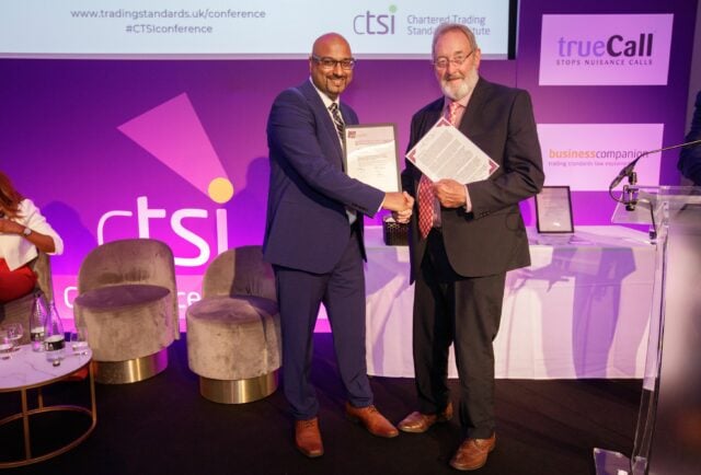 Fakir being awarded his Fellowship by Chris Armstong, Chair of the College of Fellows, Chartered Trading Standards Institute