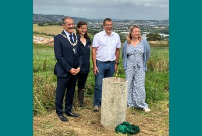 Councillor Percy Prowse (Chair of DCC), Hannah Bosence (Land Trust), Councillor Martin Wrigley (Leader of TDC), and Councillor Emma Morse (Chair of South-East Devon Habitats Regulations Partnership).