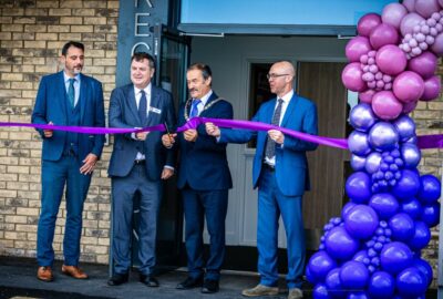 The Chairman of Devon County Council, right of middle, and local MP, left of middle, at the opening of the new school