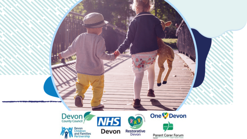 Two children holding hands as they walk over a bridge in sunlight. There are also the logos of the partners in the Devon SEND offer.