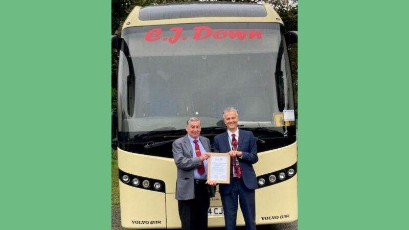 Clifford Down receives a certificate of appreciation from Damien Jones of Devon County Council