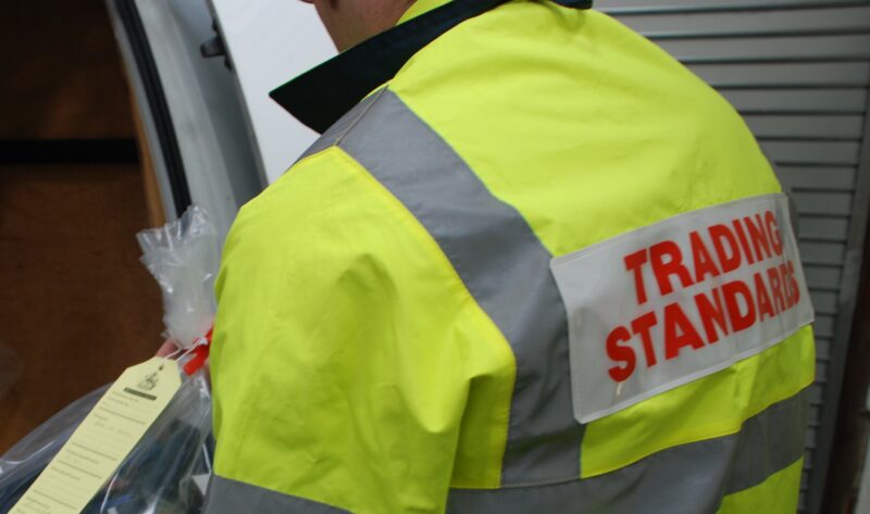 Trading Standards officer with bag of illicit goods