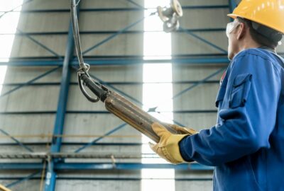 An engineer with a yellow hard hat at work