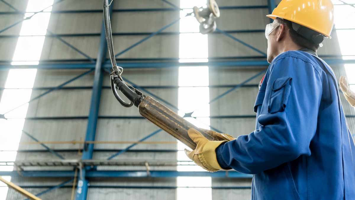 An engineer with a yellow hard hat at work