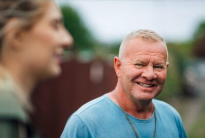 A middle age man smiling