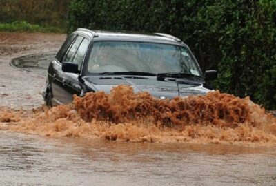 Car driving through floodwater