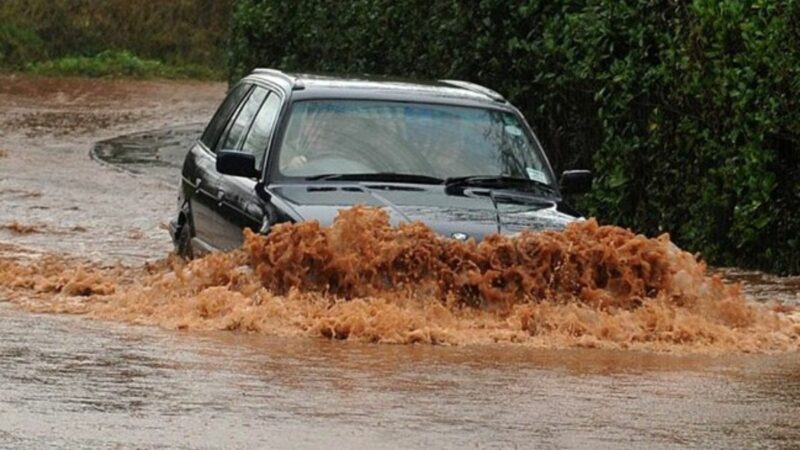 Car driving through floodwater